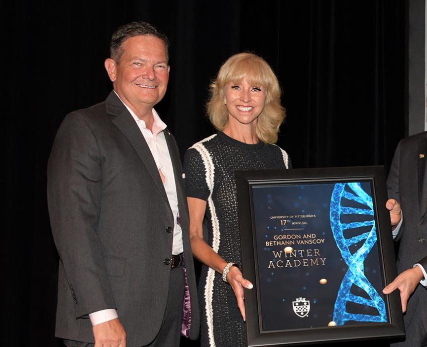 Bethann and Gordon J. Vanscoy holding award.