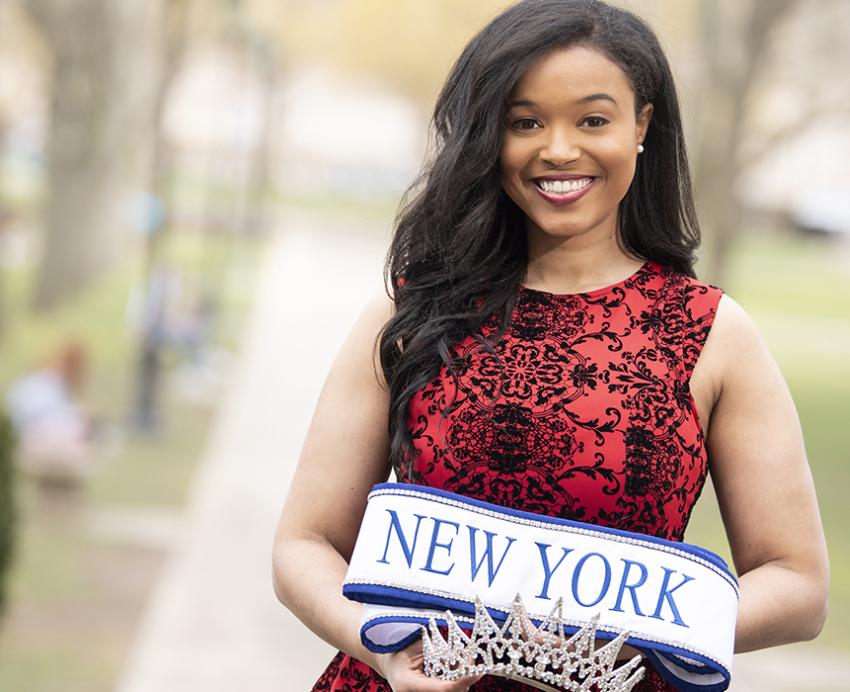 Thais Ridgeway in red dress with Miss New York crown