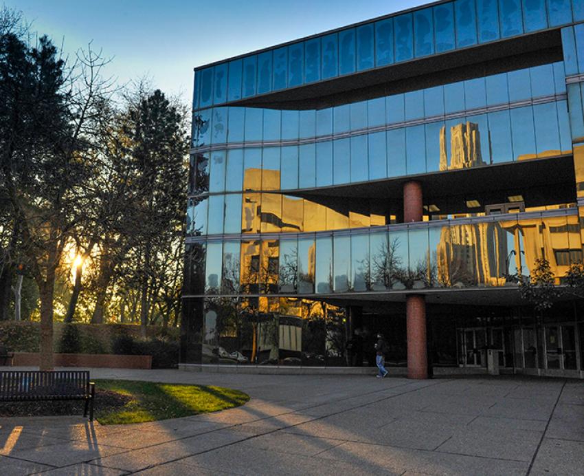 Mervis Hall with sunset in background
