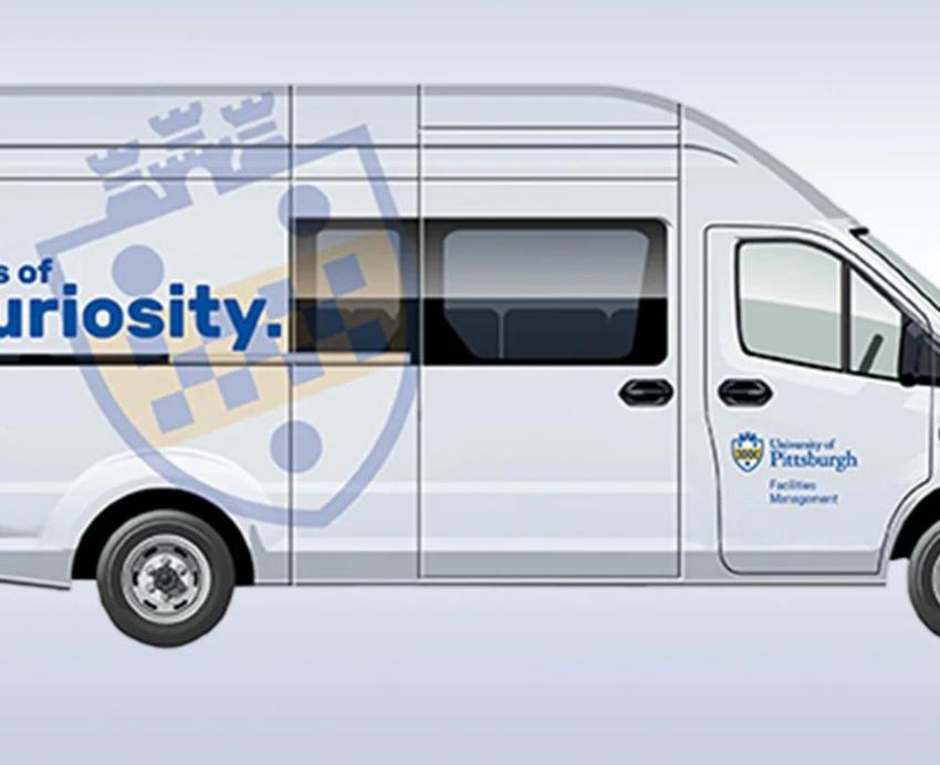 A van with a Pitt logo on the side