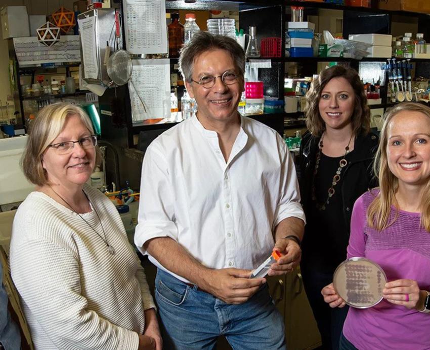 Hatfull Lab researchers standing together and smiling.