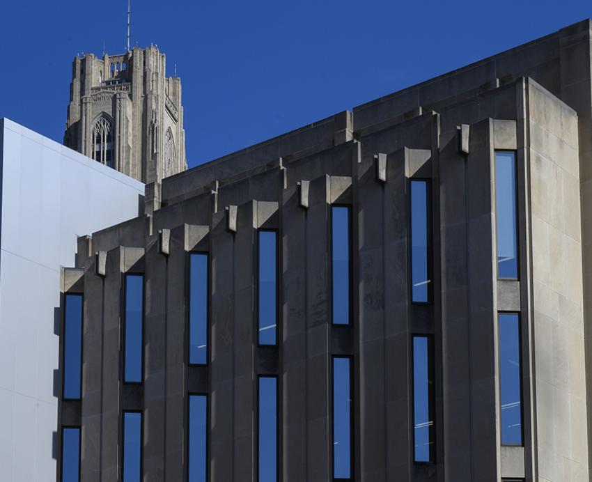 Cathedral of Learning towering behind building