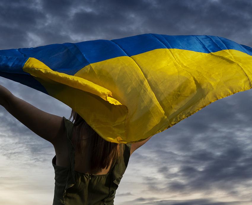 Woman holding Ukraine flag 