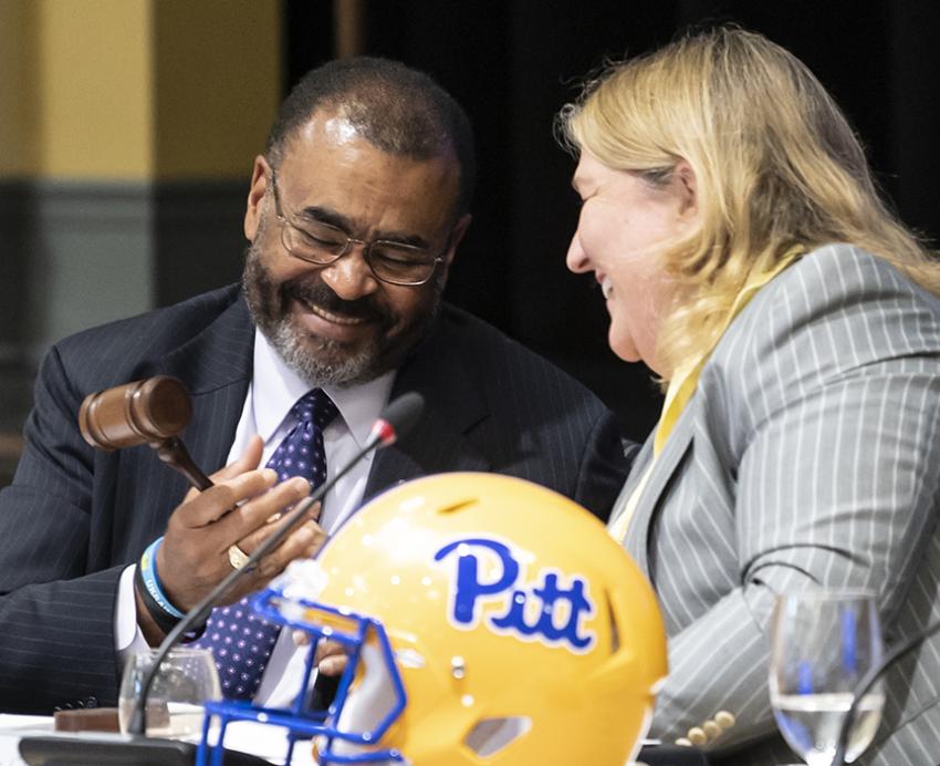 Callahan handing the board gavel to Browning