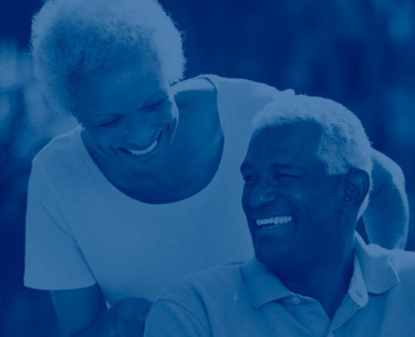 two older people smiling