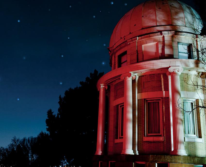 a red-tinted building with a starry background