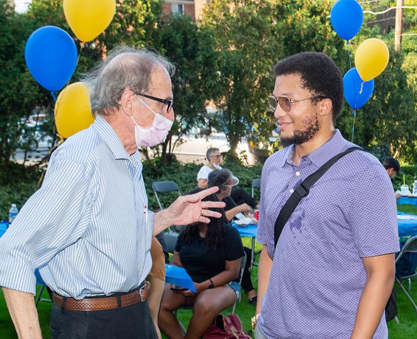 an Oakland resident and a student talking