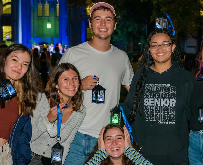 7 students smiling with their lanterns