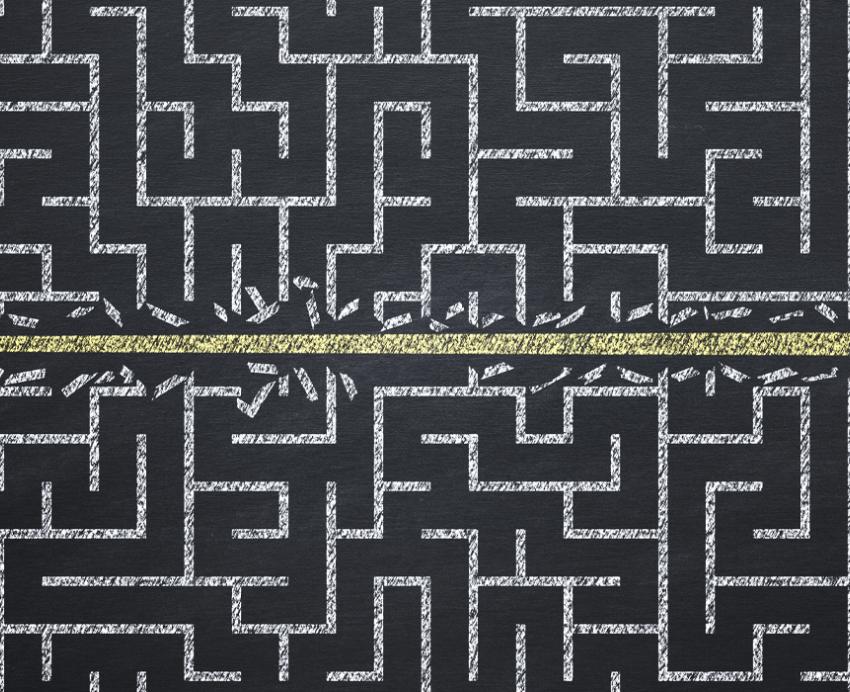 a maze with an arrow blasting through the barriers