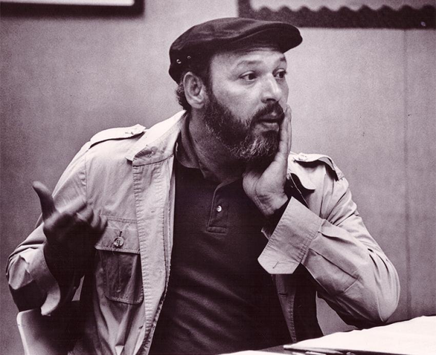 Wilson seated at a table