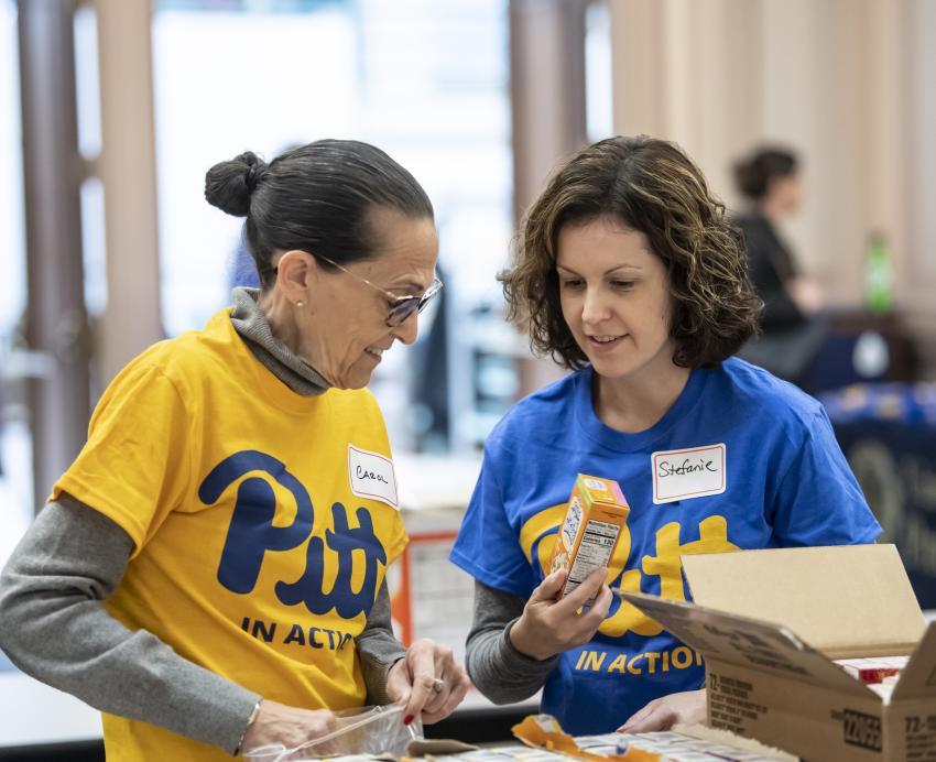 volunteers pack boxes