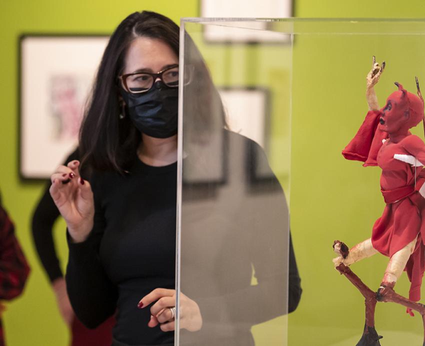 a woman looks at art