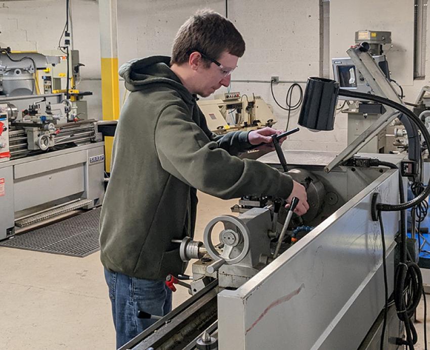a person working at a machine