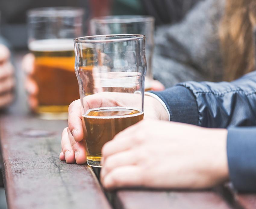 Glasses of beer on a wooden table