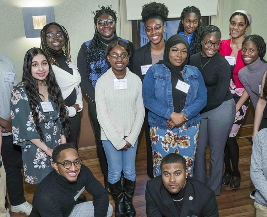 Scholars pose in a group photo