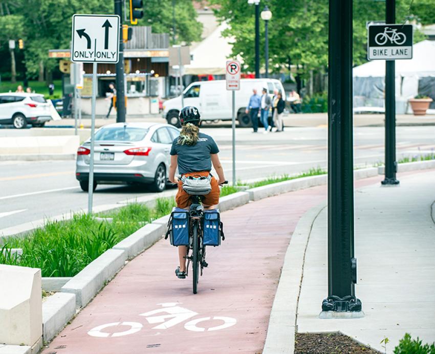 A person rides a bike in a bike lane