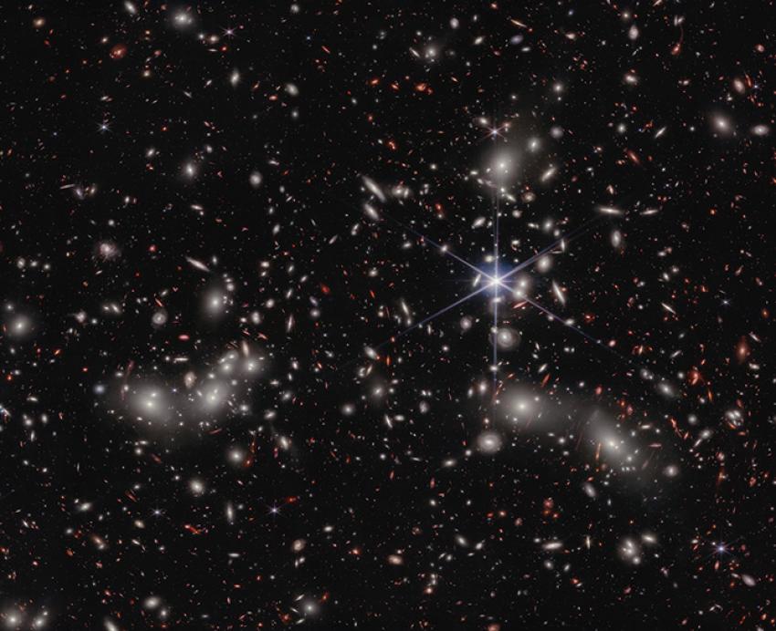 Mulitcolored galaxies against a black sky