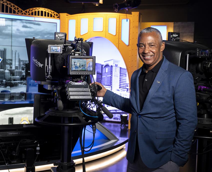 Smith next to a camera in Pitt Studios