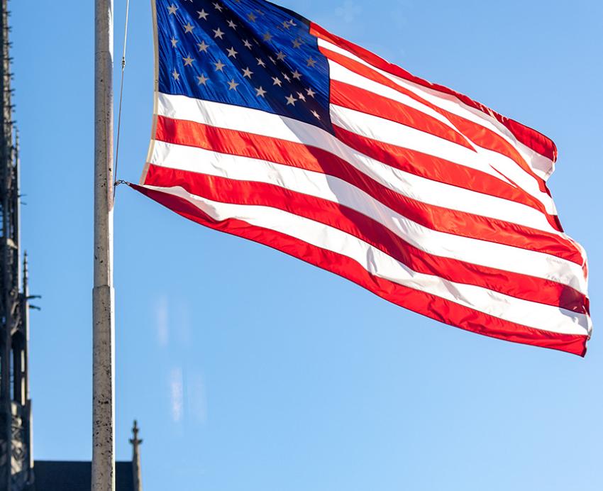 An American flag flies with Heinz Memorial Chapel in the background