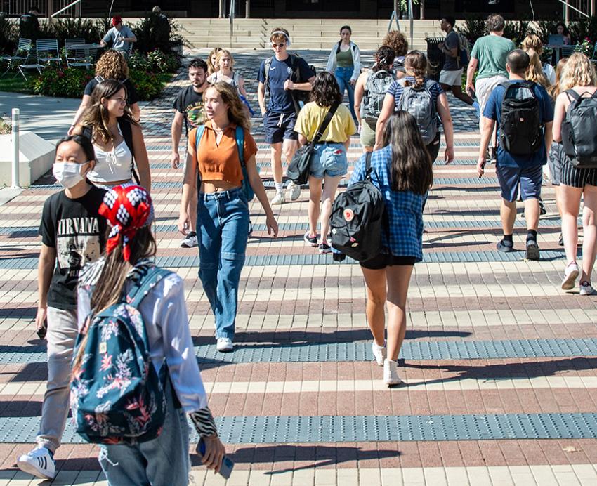 People walk on a crosswalk