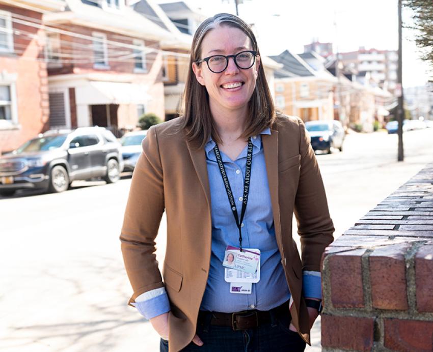 Chappell stands on a Pittsburgh sidewalk