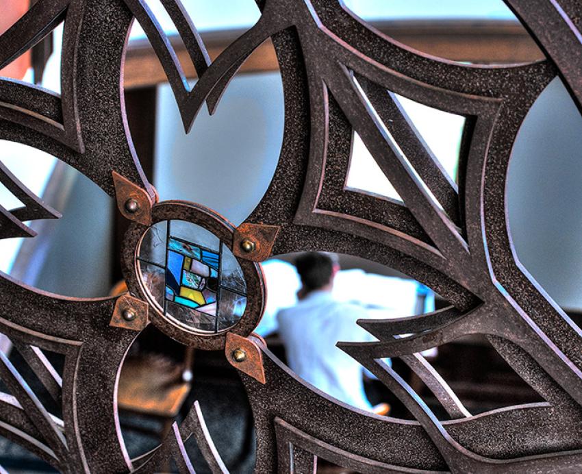 A stained glass window in decorative iron