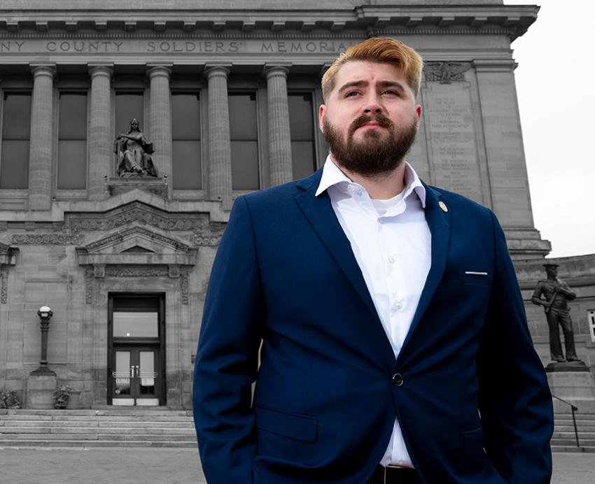 Rehbach stands in front of Soldiers and Sailors Memorial Hall and Museum