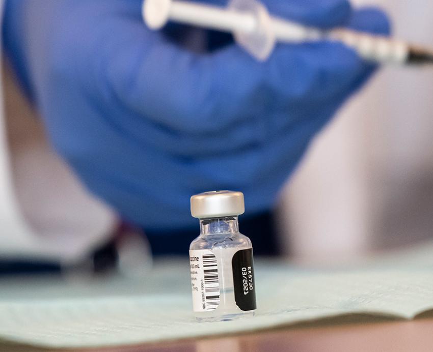 A small glass vaccine bottle