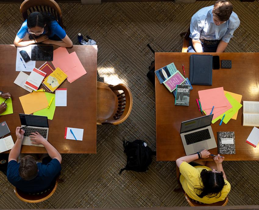 An overhead shots of students studying at two tables