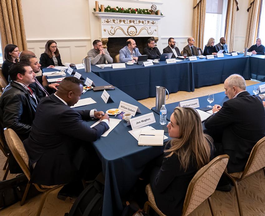 People sit around a large table
