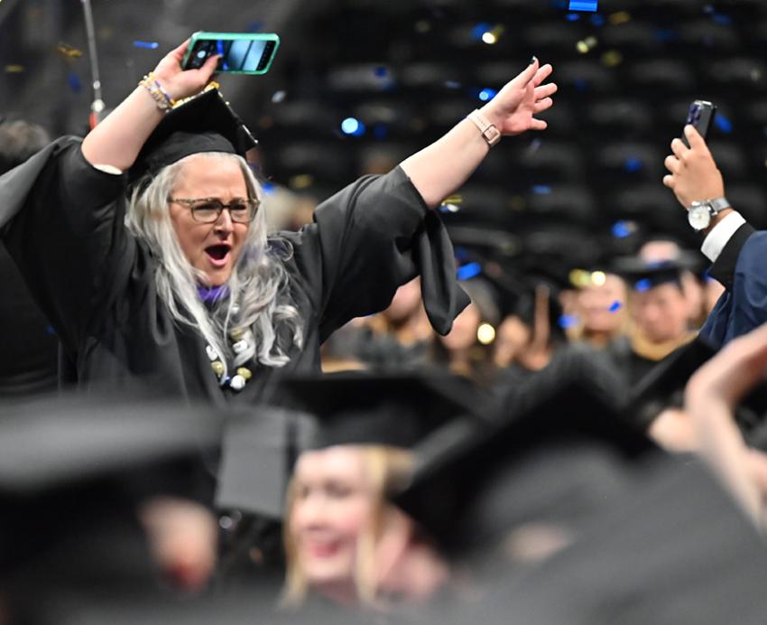 Graduates dance in celebration as confetti falls