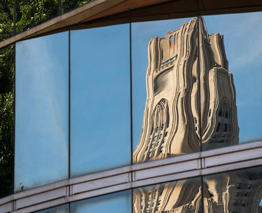 The Cathedral of Learning, distorted and reflected in glass.