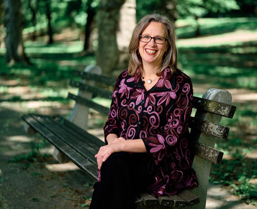 Williams sits on a bench