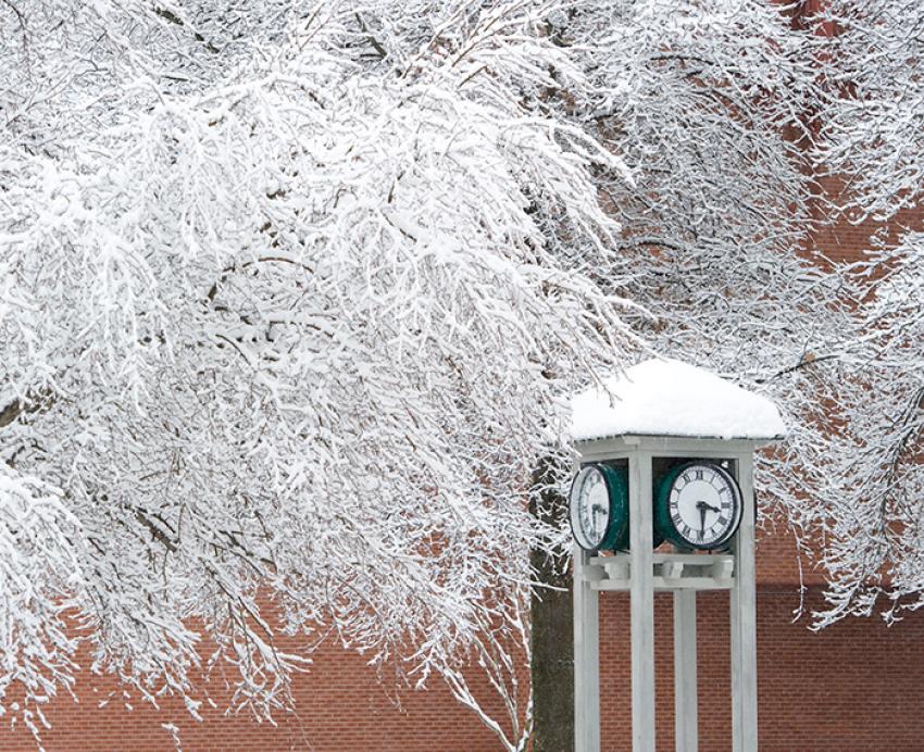 A clock tower in the snow