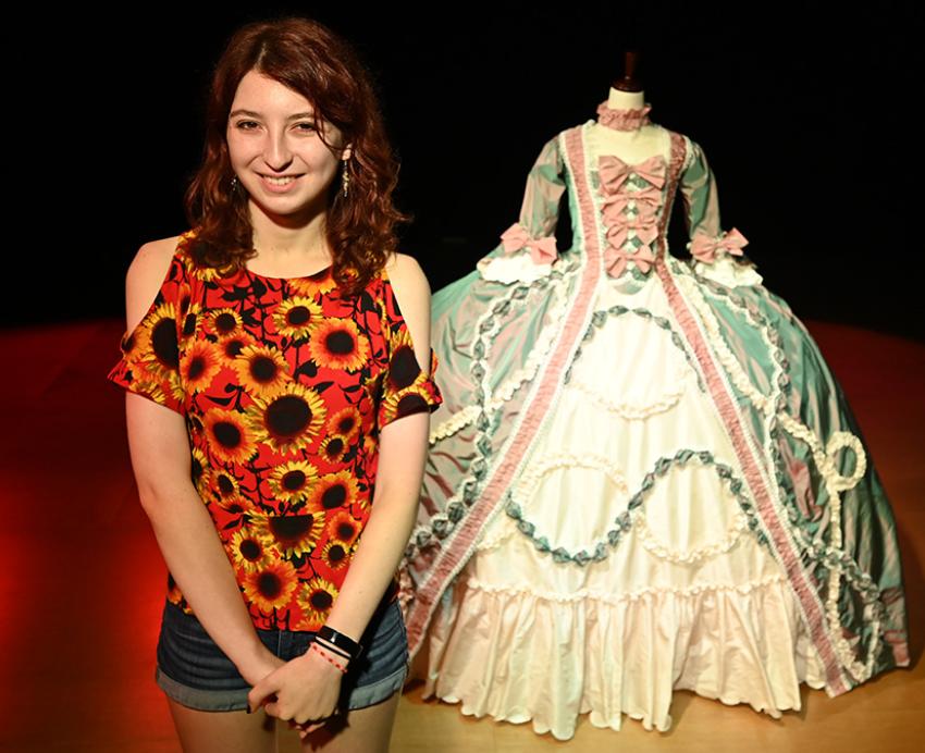 Maya Jones stands in front of her French court gown