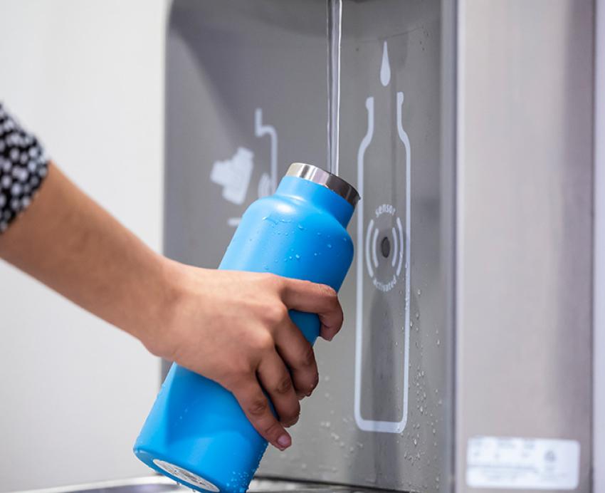 A blue bottle at a refilling station
