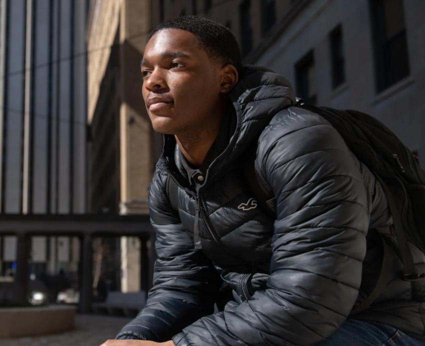Xavier Littlejohn on the Pitt campus in a black jacket