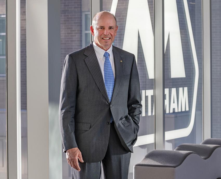 John Surma in a gray suit