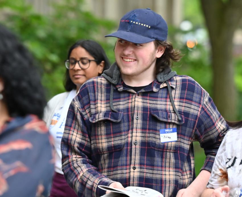 Four people walking outside on Pitt's campus