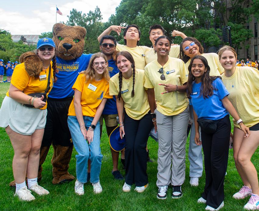Students pose with Roc on Cathedral Lawn