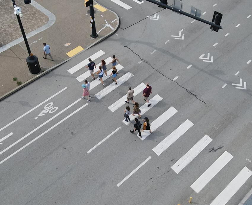A drone photo of people using a crosswalk