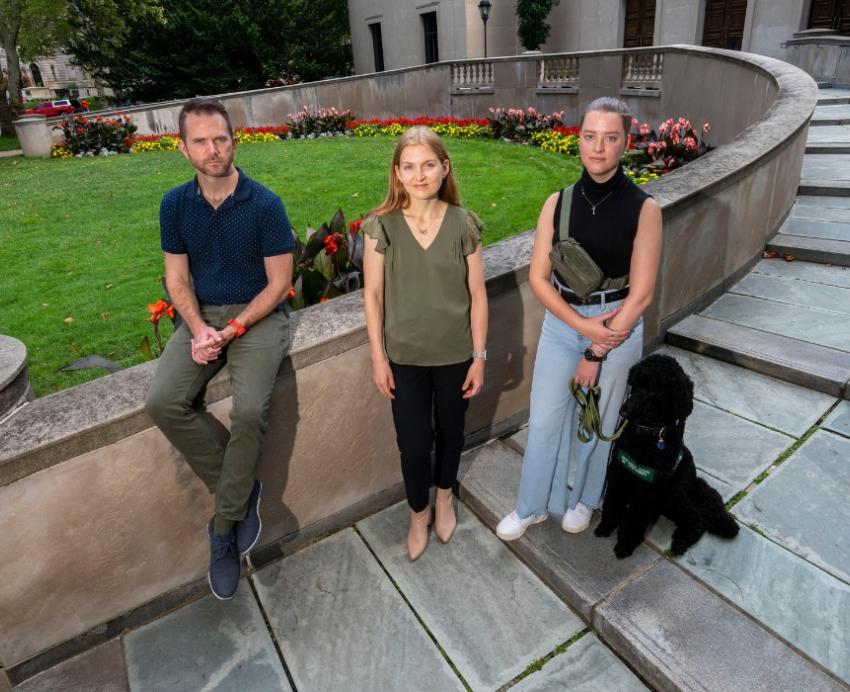 Individuals connected with Pitt's Disability Studies Certificate pose for a group portrait on the starts on Frick Fine Arts.