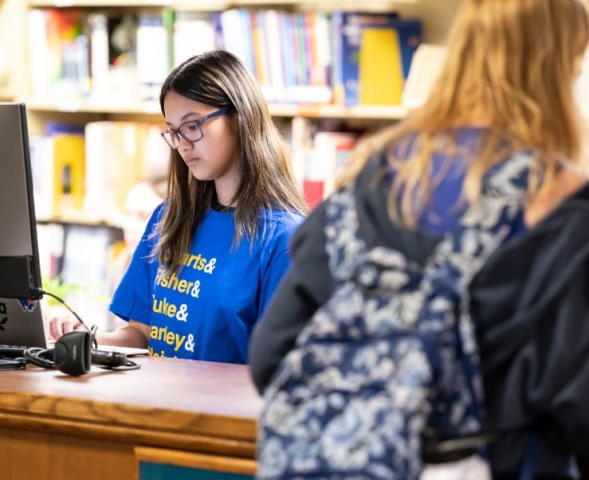 Two students in a library.