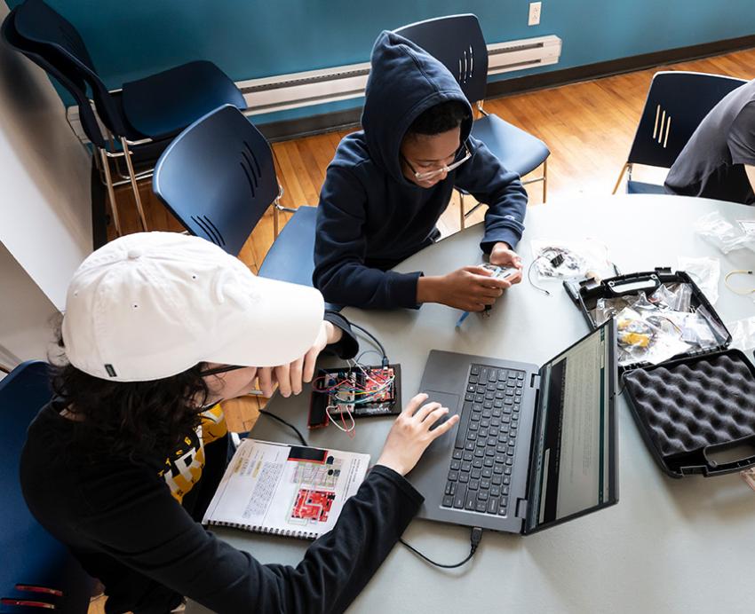 Students work on laptops a the CEC