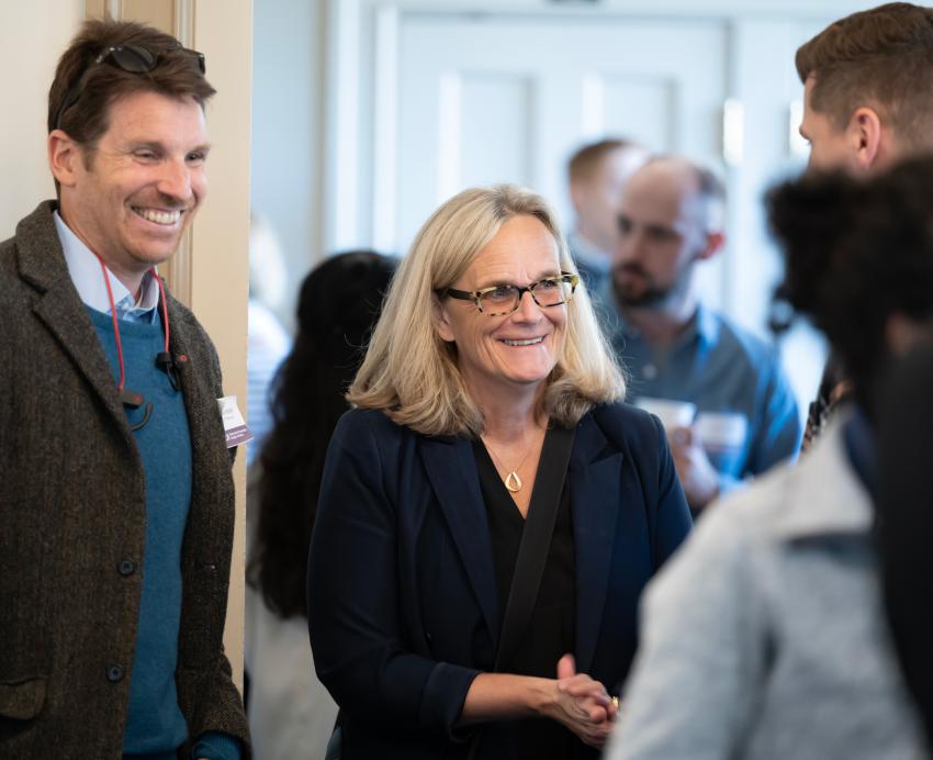 Lise Vesterlund and other Behavioral Economic Design Initiative workshop attendees smile.