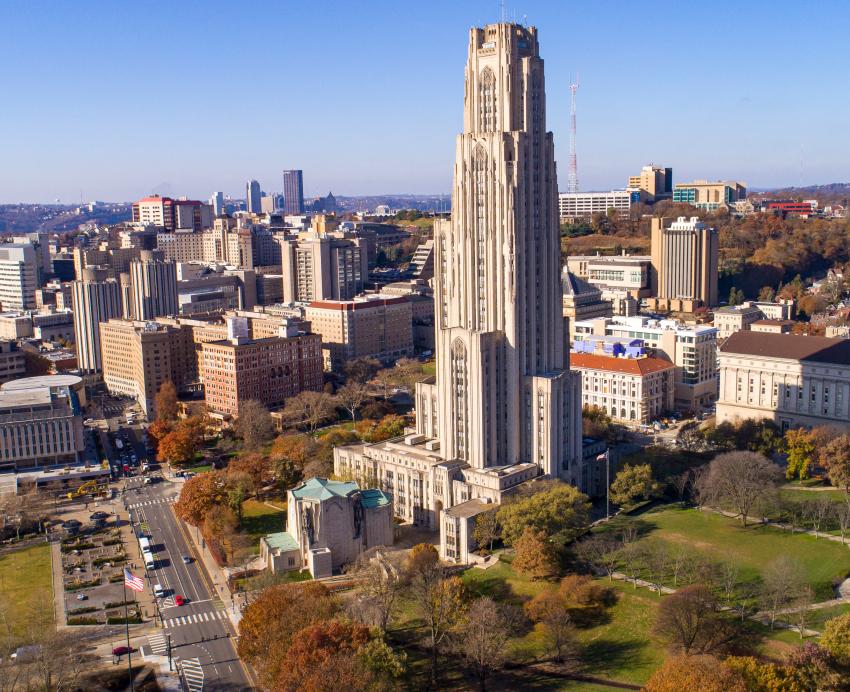 Aerial photo of the Cathedral of Learning, campus and Oakland.