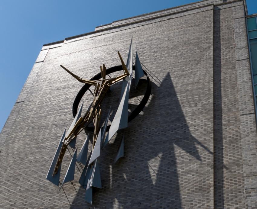The front of the School of Public Health Building and sculpture.