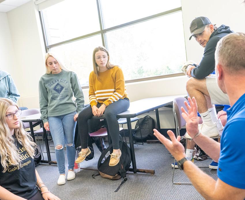 An instructor teaching emergency medicine students