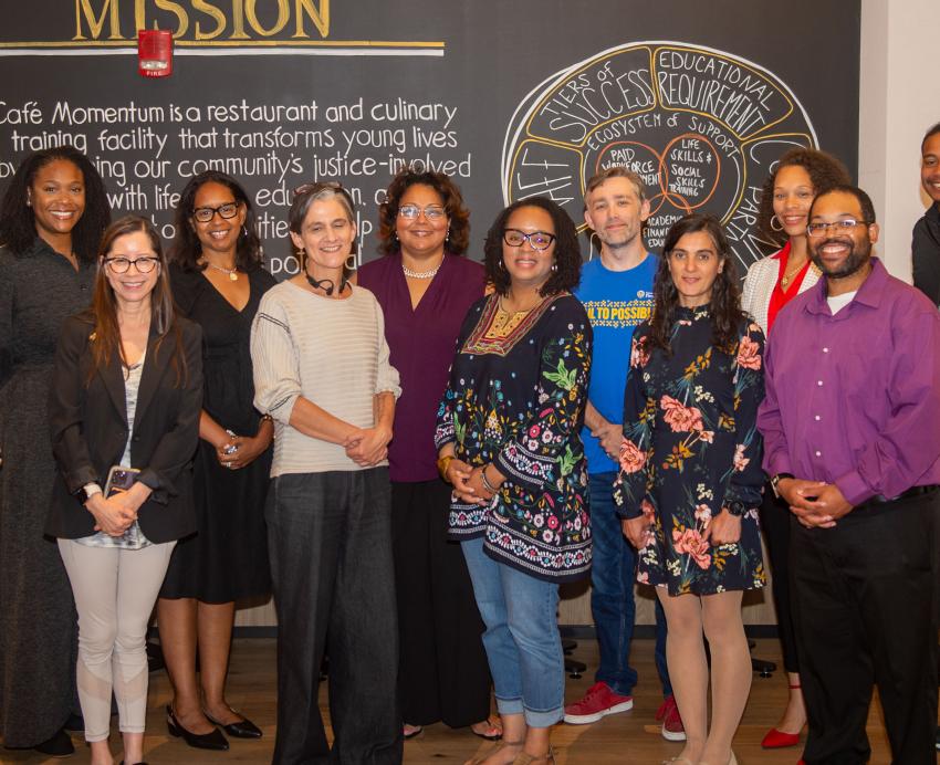 The Nonprofit Capacity Building Program cohort poses for a group photo at Café Momentum.