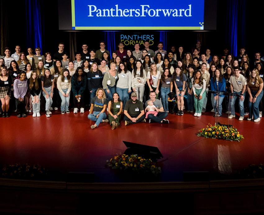 A large group of students on a stage